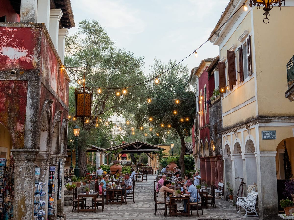 Tables under festoon lights in the lane at Danilia Village