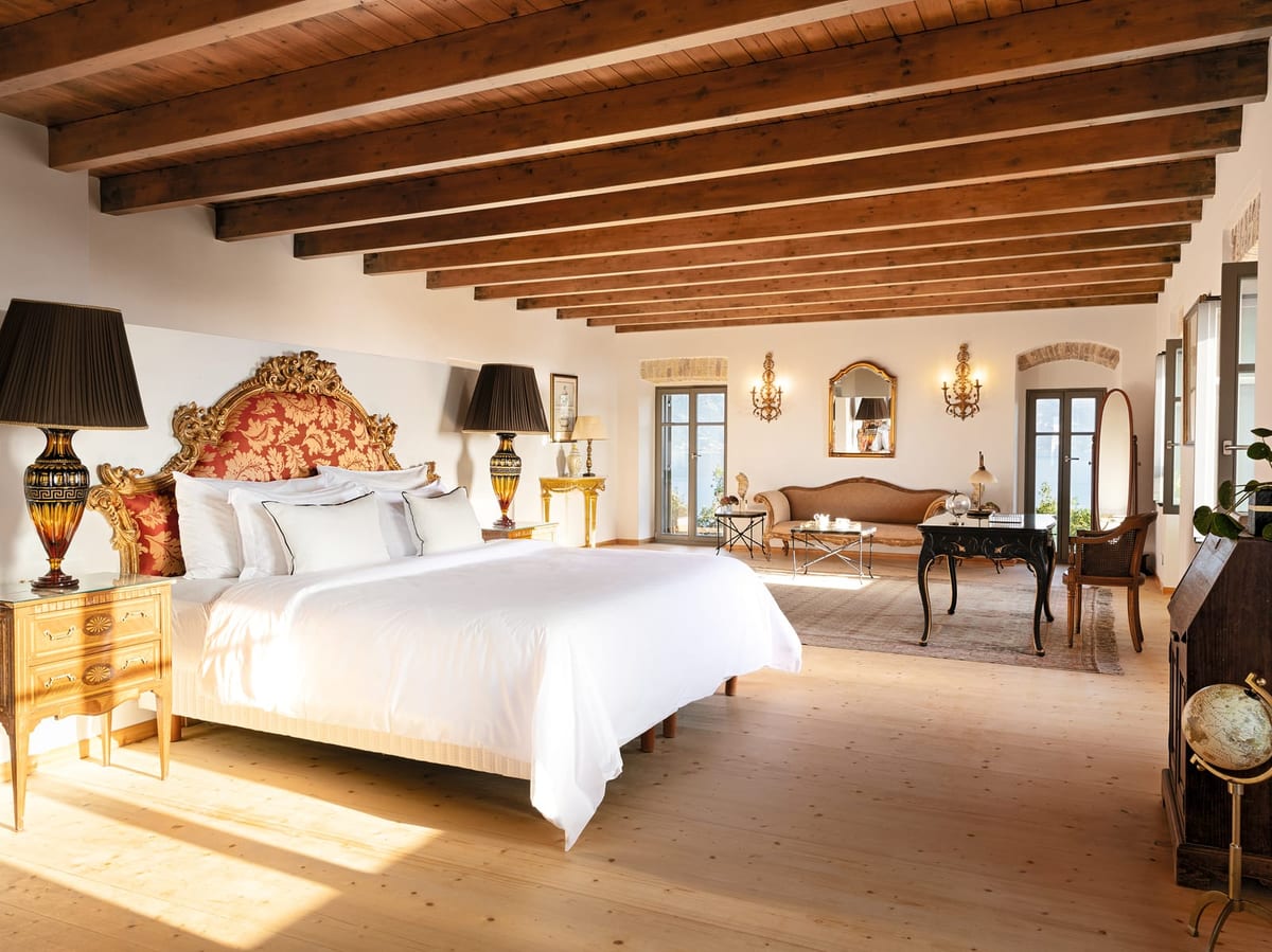 Beamed bedroom with antique furniture and sea doors, Medusa Estate